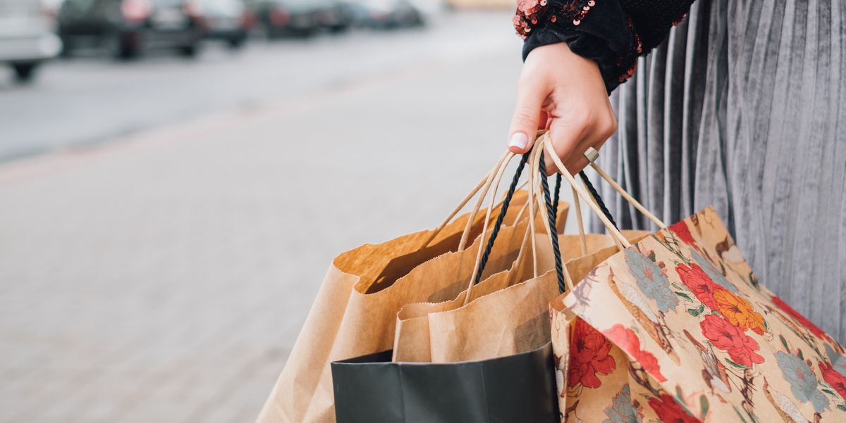 close-up-of-a-woman-holding-shopping-bags-royalty-free-image-967287882-1563207374